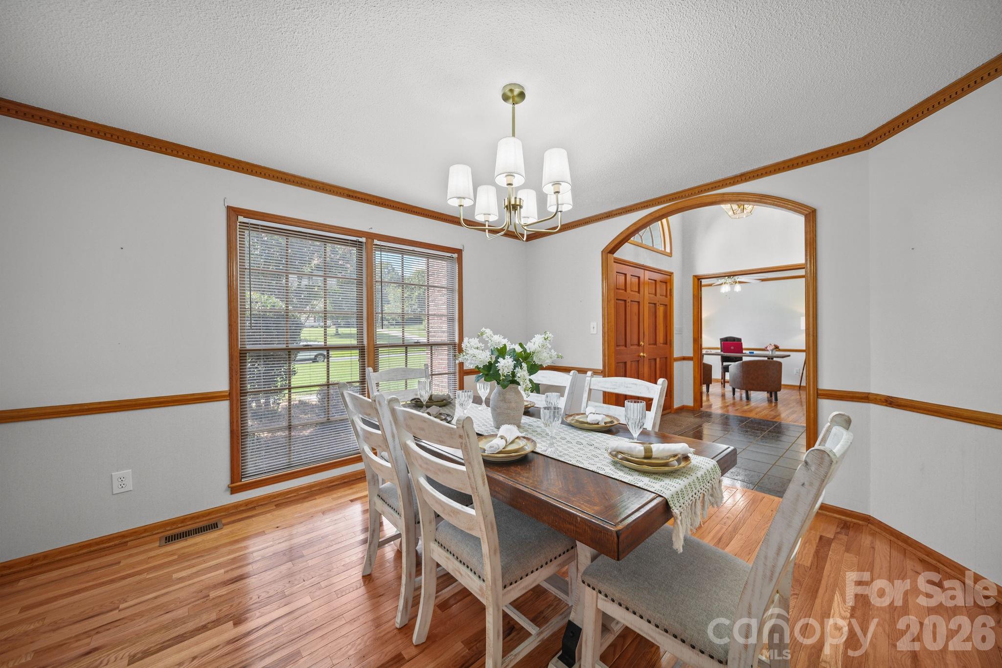 Pristine hardwood flooring, crown molding, natural light, and an open flow make entertaining a dream. - 3008 Eaker Drive, Cherryville