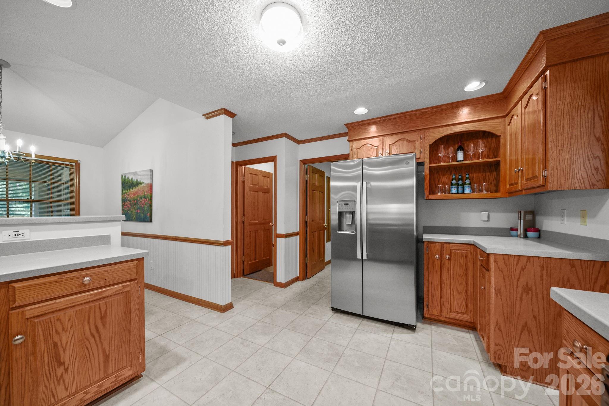 Straight ahead, you'll find the laundry room/drop zone leading to the two-car attached garage. And the primary suite is located to the left. - 3008 Eaker Drive, Cherryville