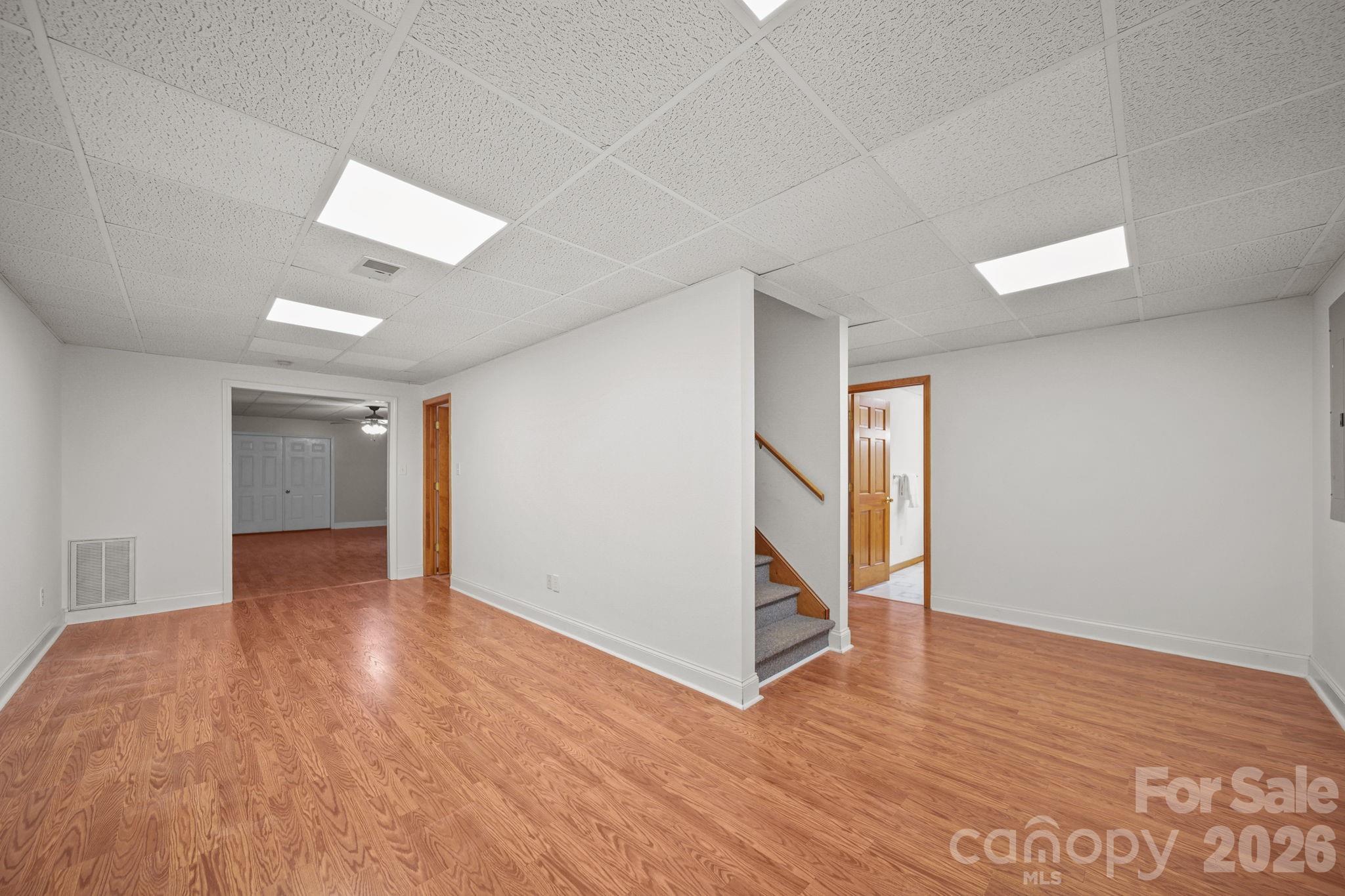 Downstairs/basement has nearly 1100 square feet of finished living space, including a bedroom, bathroom, family room, and open space to use however your imagination sees fit. - 3008 Eaker Drive, Cherryville