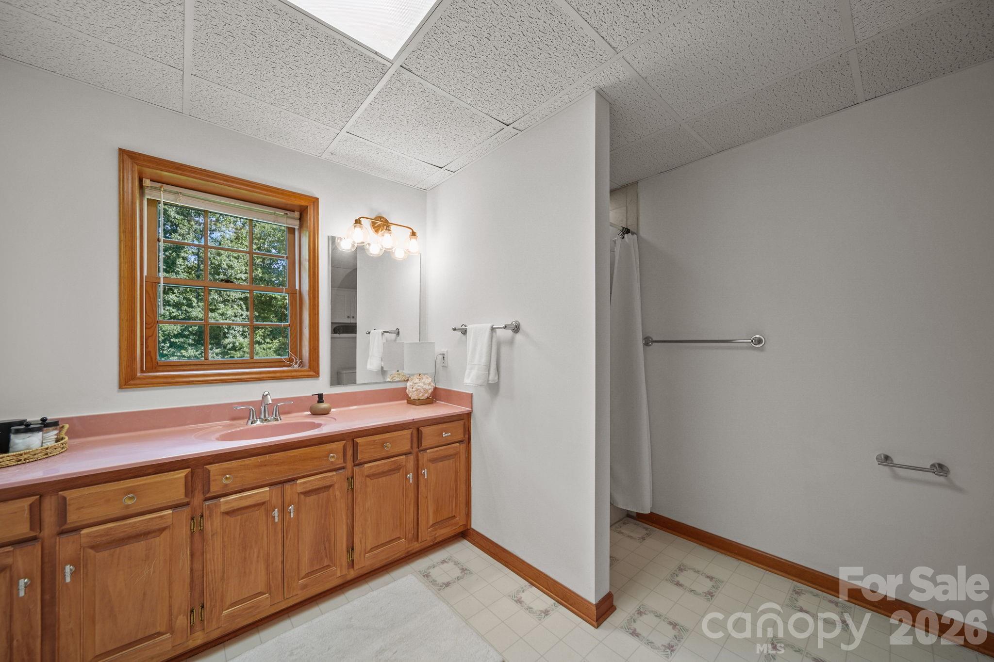 Downstairs/basement bathroom with tiled shower. - 3008 Eaker Drive, Cherryville