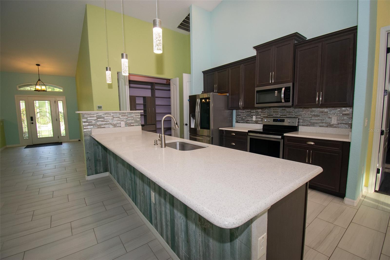 Kitchen and front door entrance. - 225 BIRCHWOOD DR, PALM COAST
