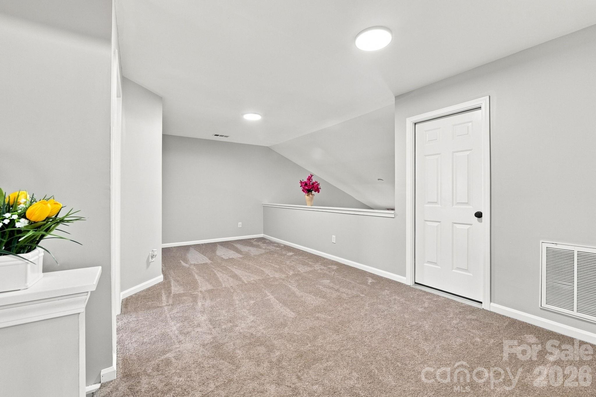 Open loft with walk-in attic storage attached - 121 Kase Court, Mooresville