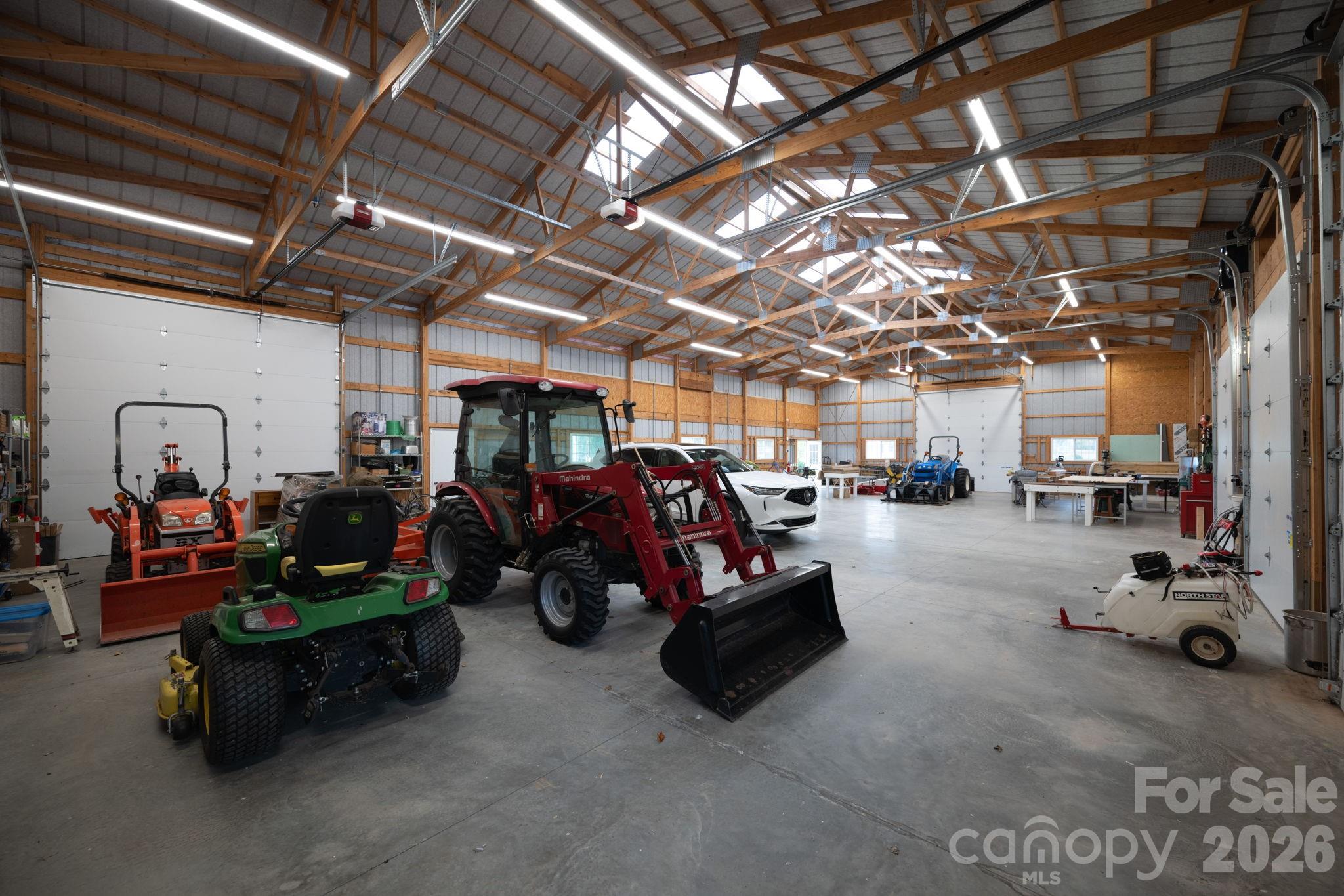 Interior of equipment building, 2 door entrances, and 4 motorized garage doors - 1260 Beaver Island Trail Road, Walnut Cove
