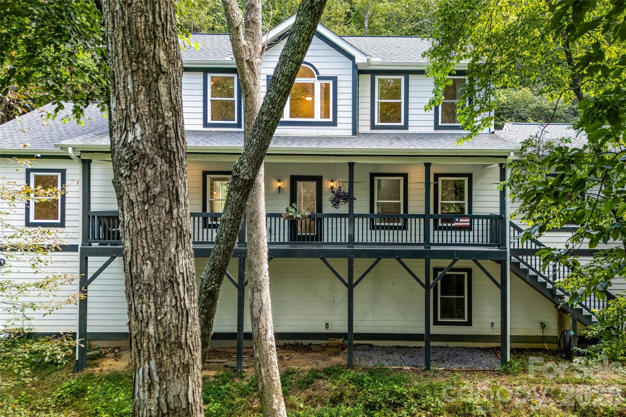 Rear exterior with covered porches - 820 Merrills Cove Road, Asheville