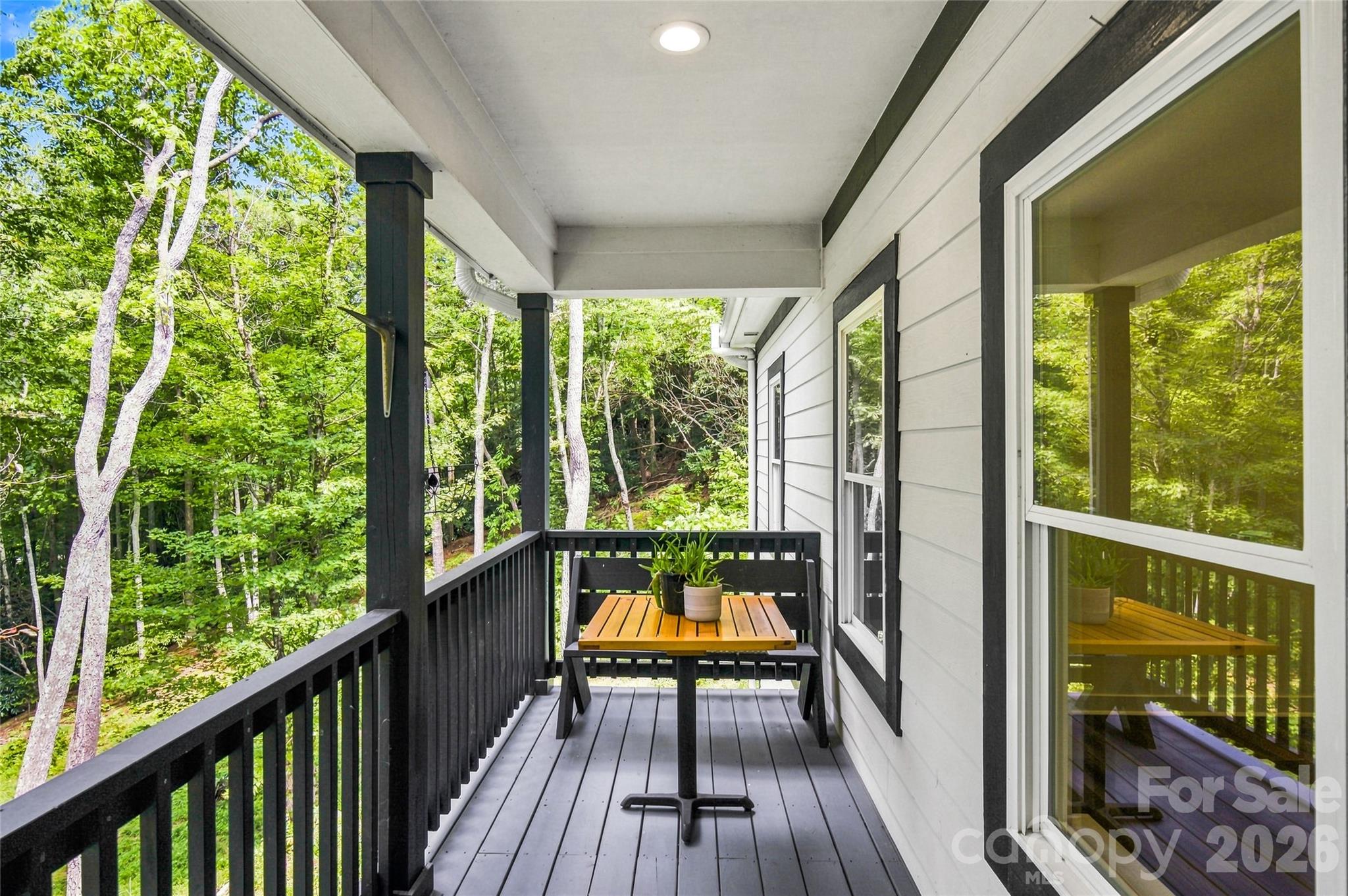 Covered porch overlooking grounds - 820 Merrills Cove Road, Asheville