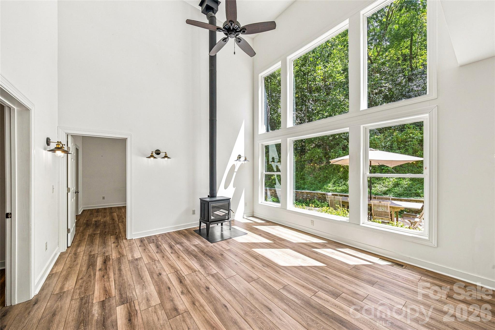 Great room overlooking stone patio and grounds - 820 Merrills Cove Road, Asheville