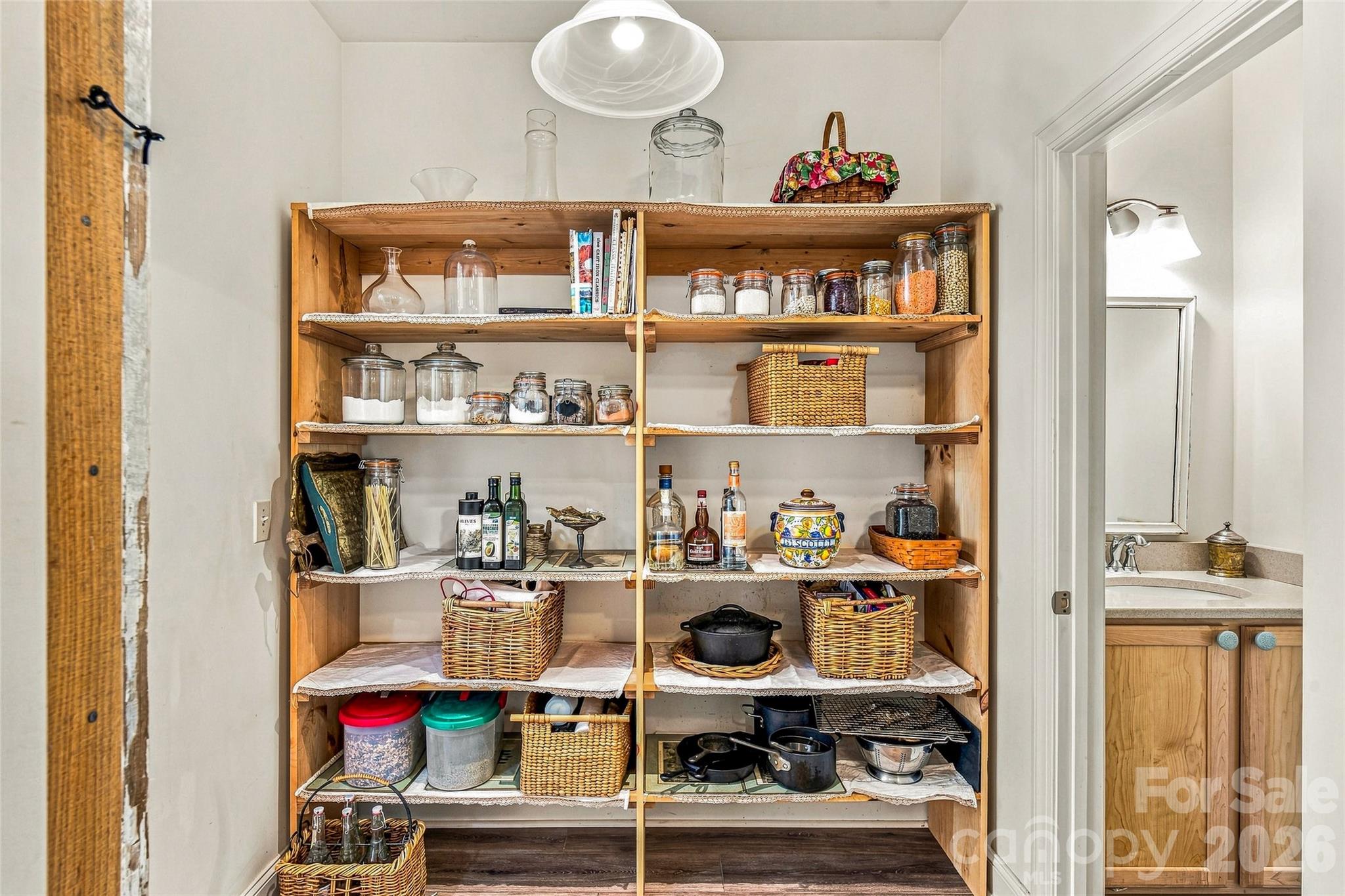 Walk-in pantry with built-in shelving - 820 Merrills Cove Road, Asheville