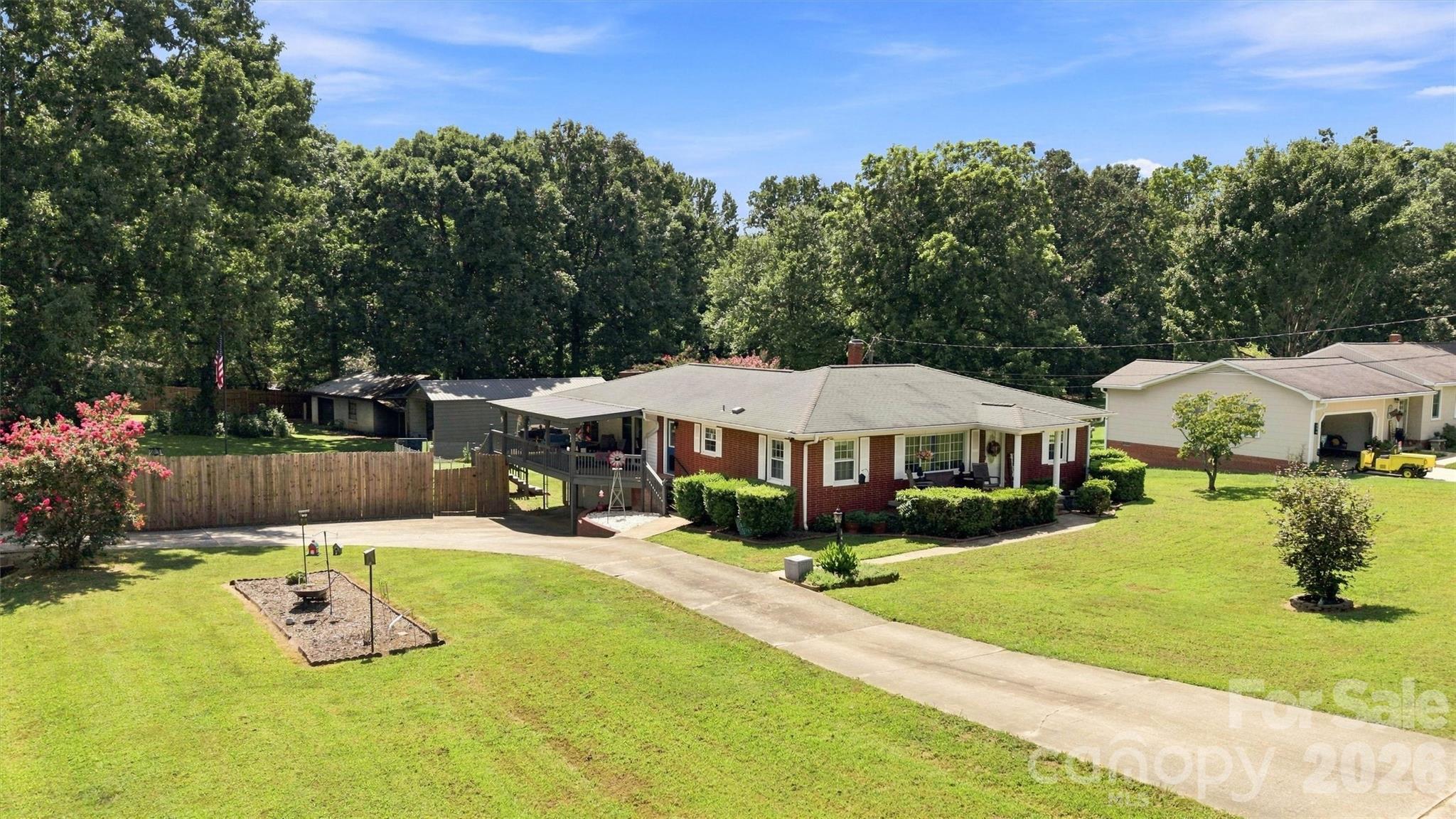 148 Era St. Troutman offers tons of privacy. 3 outbuildings with electric power. Fully fenced. - 148 Era Street, Troutman