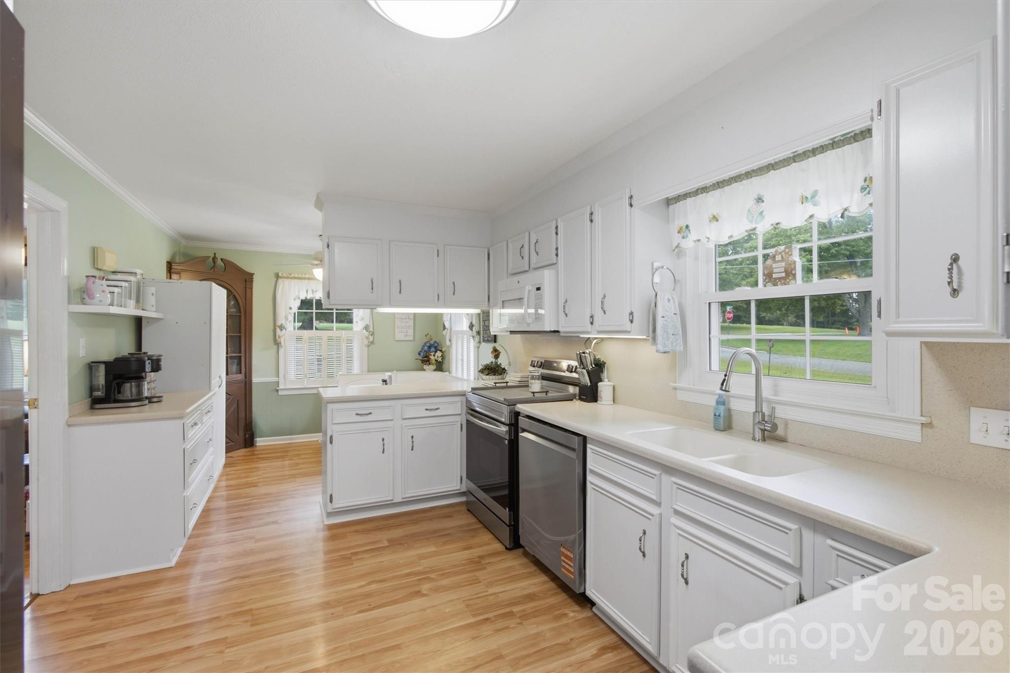Kitchen provides plenty of counter space and cabinets. - 148 Era Street, Troutman