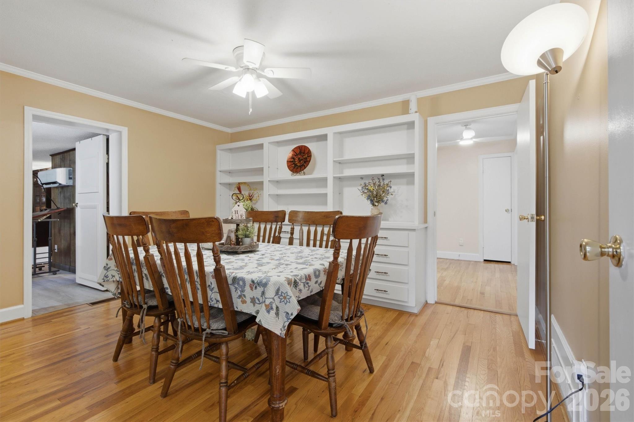 Beautiful formal dining room provides hardwood floors and built in cabinetry. - 148 Era Street, Troutman