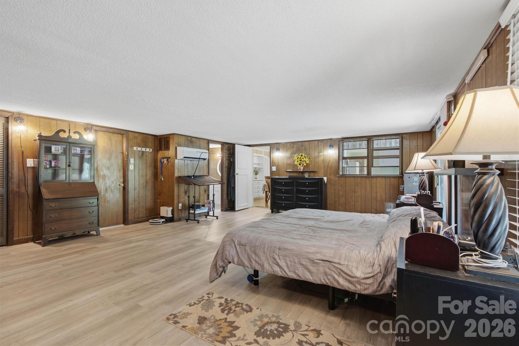 Primary bedroom/Den has door to full basement below. - 148 Era Street, Troutman