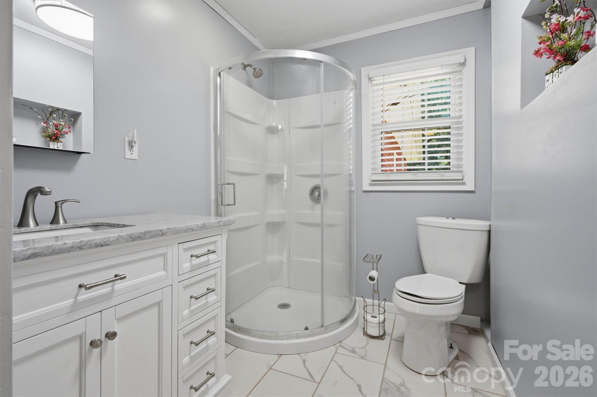 Remodeled guest bathroom on main level. - 148 Era Street, Troutman