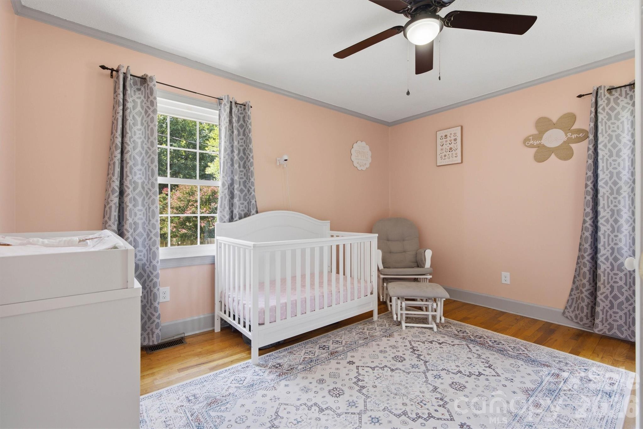 Bedroom 3 provides plenty of natural lighting and hardwood flooring. - 148 Era Street, Troutman