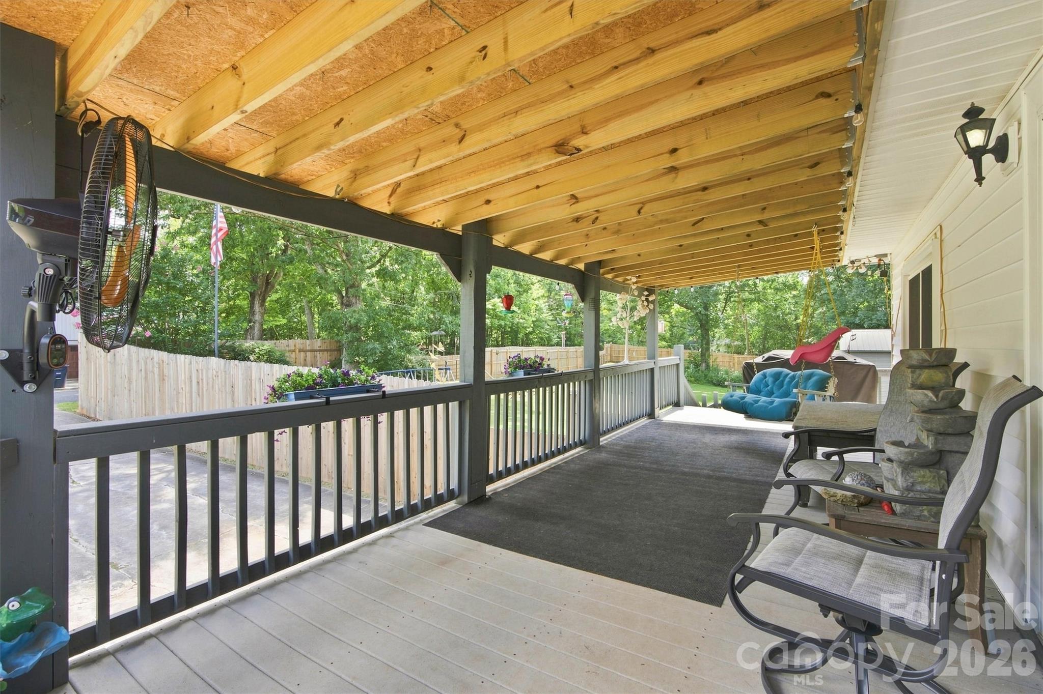 Newly covered deck provides plenty of time to relax and enjoy the upcoming fall weather. - 148 Era Street, Troutman