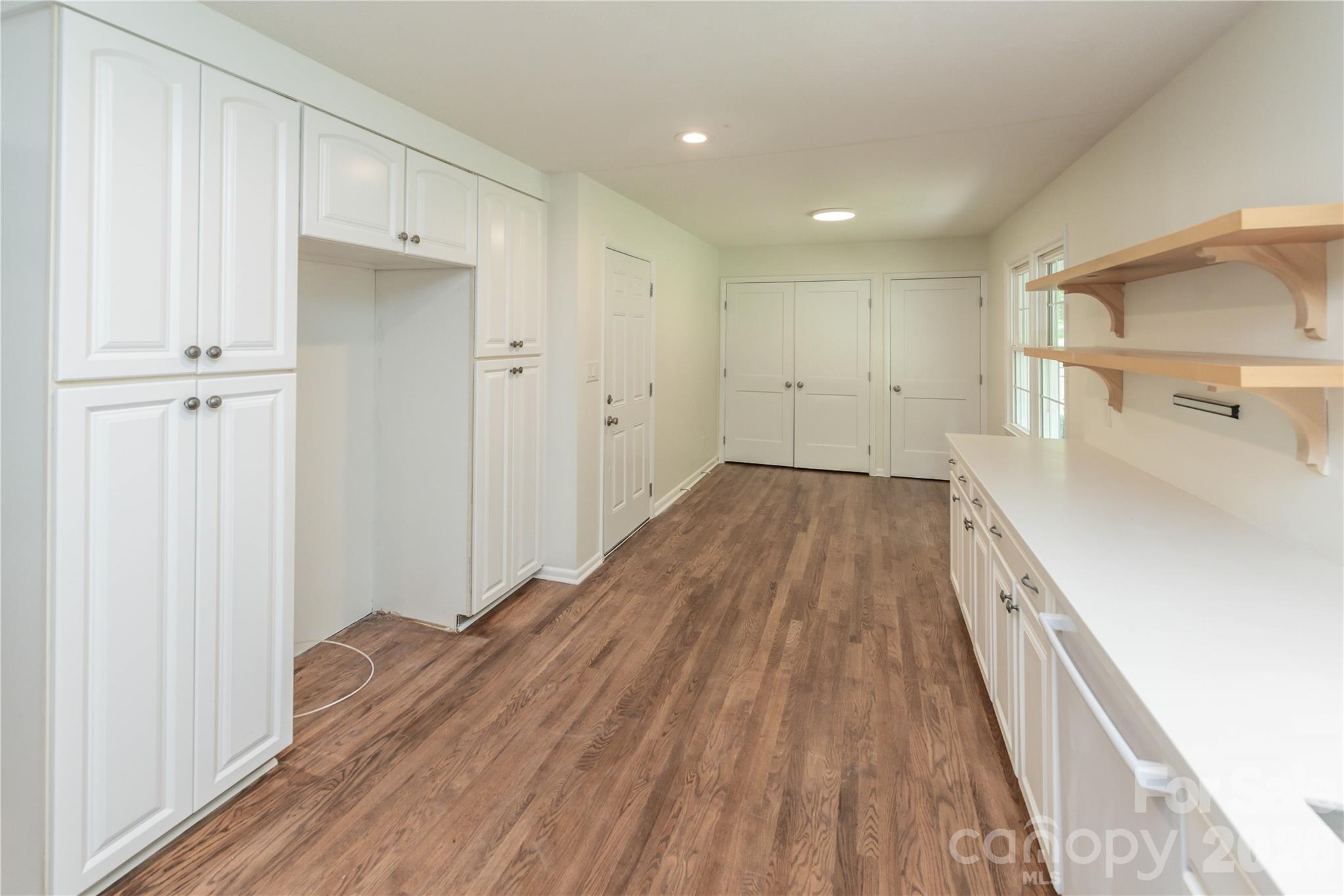 Fridge nook with pull out shelving and storage system surrounding - 171 Suburban Avenue NE, Concord