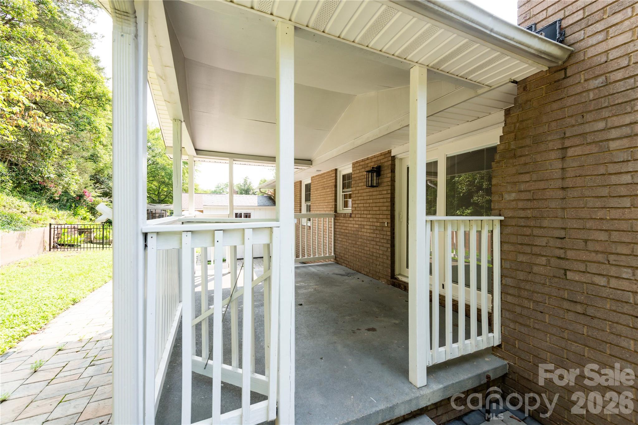 Covered patio with railing - 171 Suburban Avenue NE, Concord