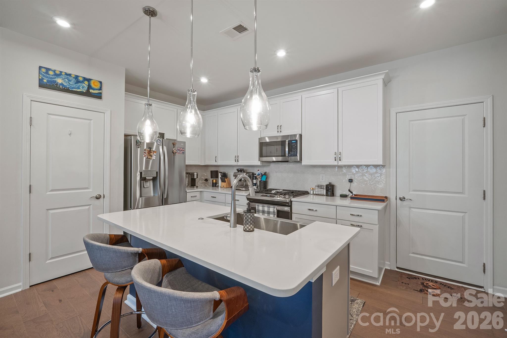 Kitchen with quartz and tile backsplash - 6161 Pierce Lane, Kannapolis