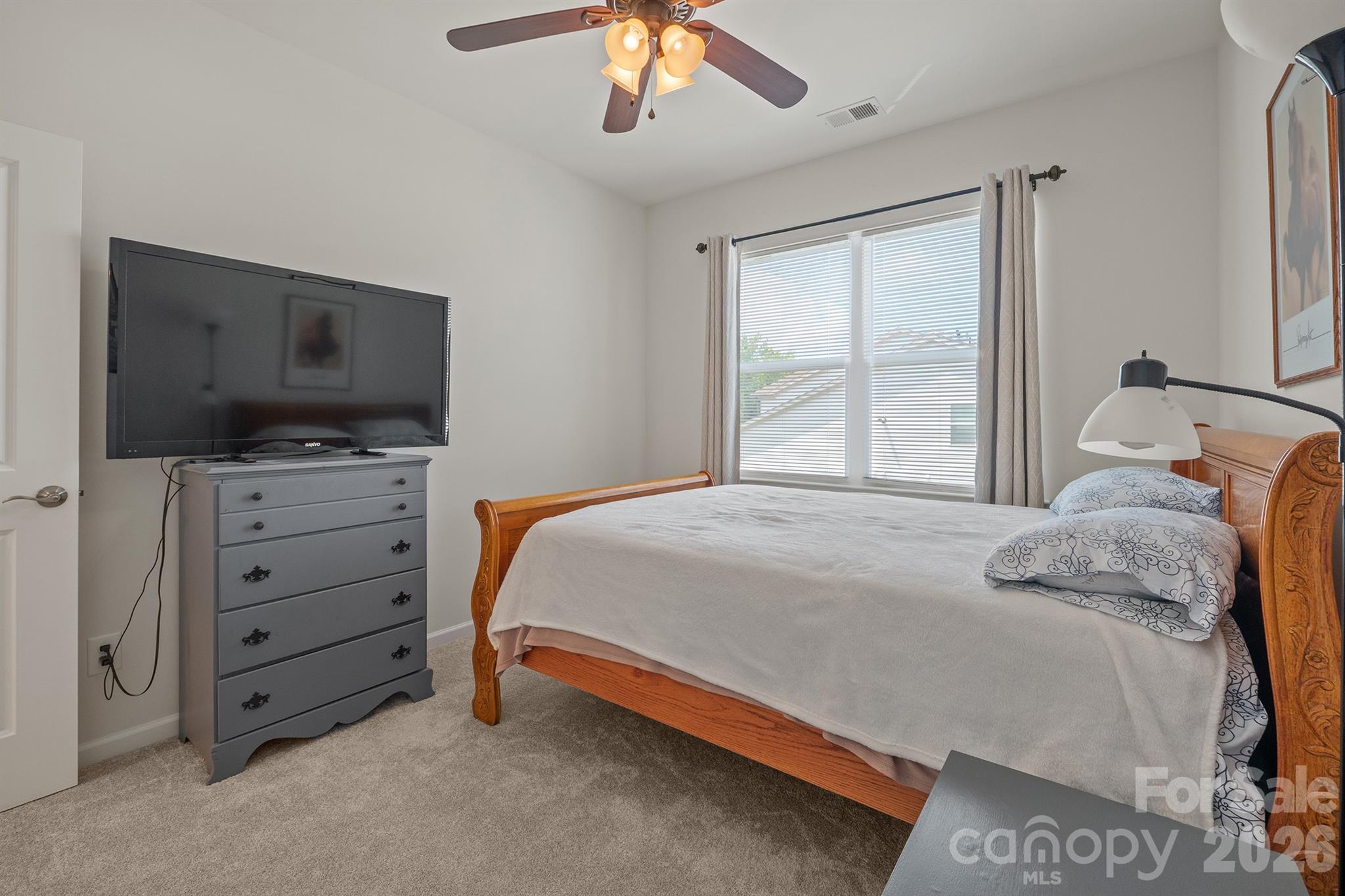 Bedroom 2 with ceiling fan and walk in closet - 6161 Pierce Lane, Kannapolis
