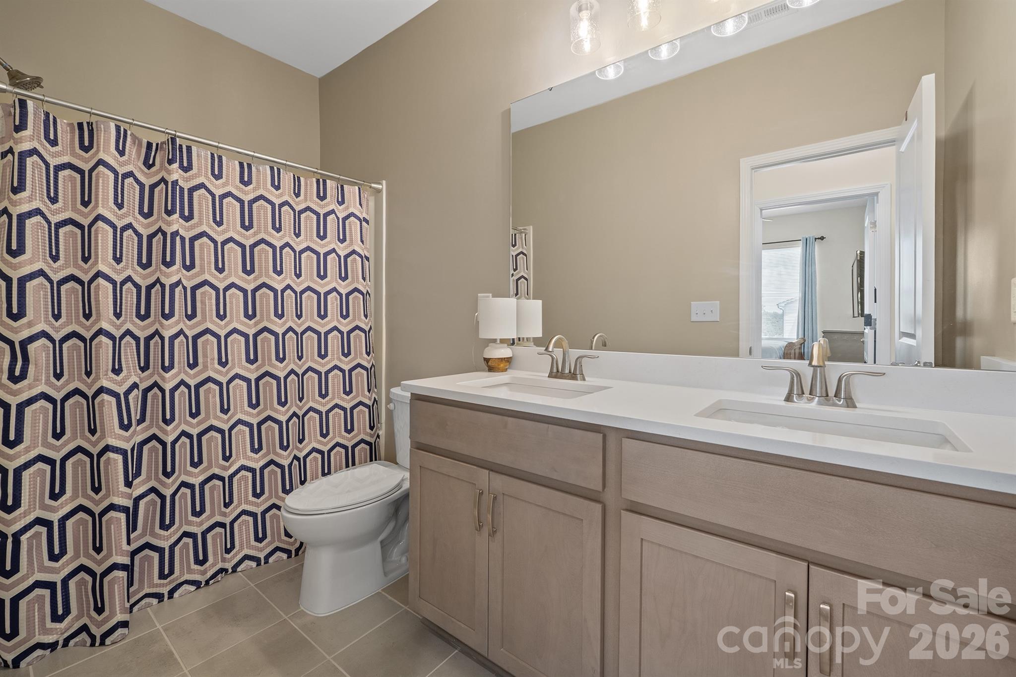 Bathroom 2 with quartz countertops and tile flooring - 6161 Pierce Lane, Kannapolis