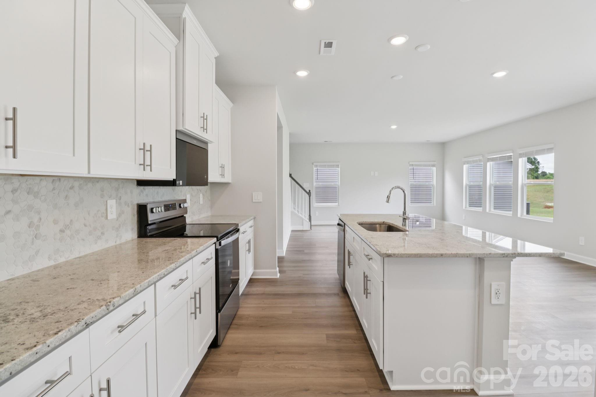 Photo is not of the actual home but is an inspirational photo of builder’s model home and may depict options, furnishings, and/or decorator features that are not included. - 2310 Snapdragon Court, Stanley