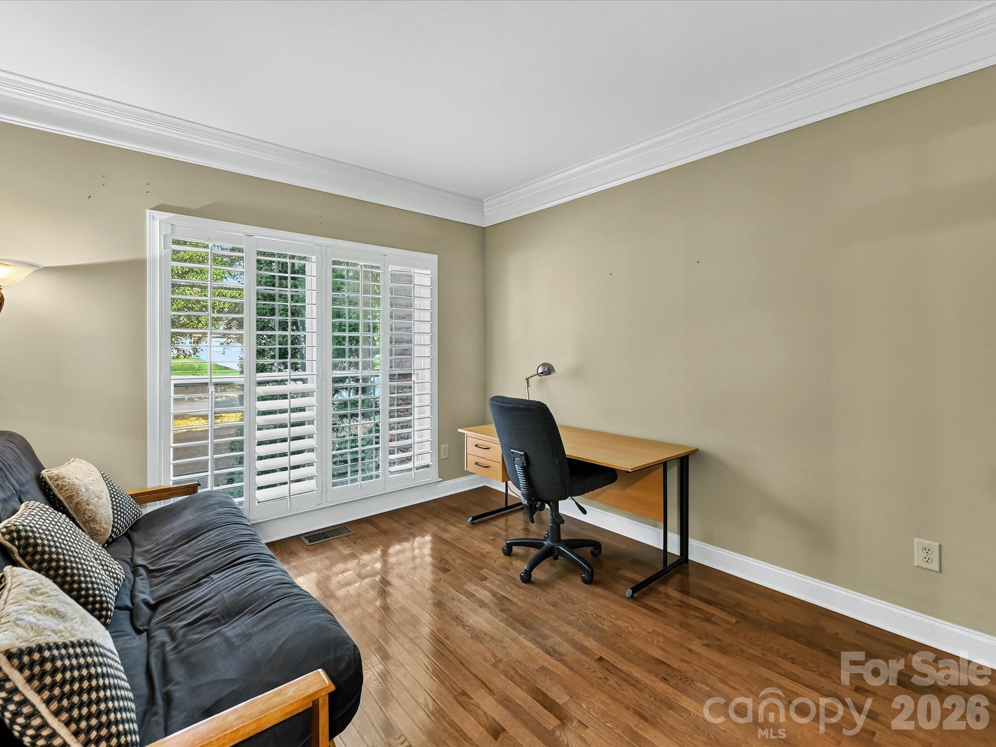 French doors open to a versatile main-level flex space, ideal for a home office, study, or sitting room. - 11203 Warfield Avenue, Huntersville