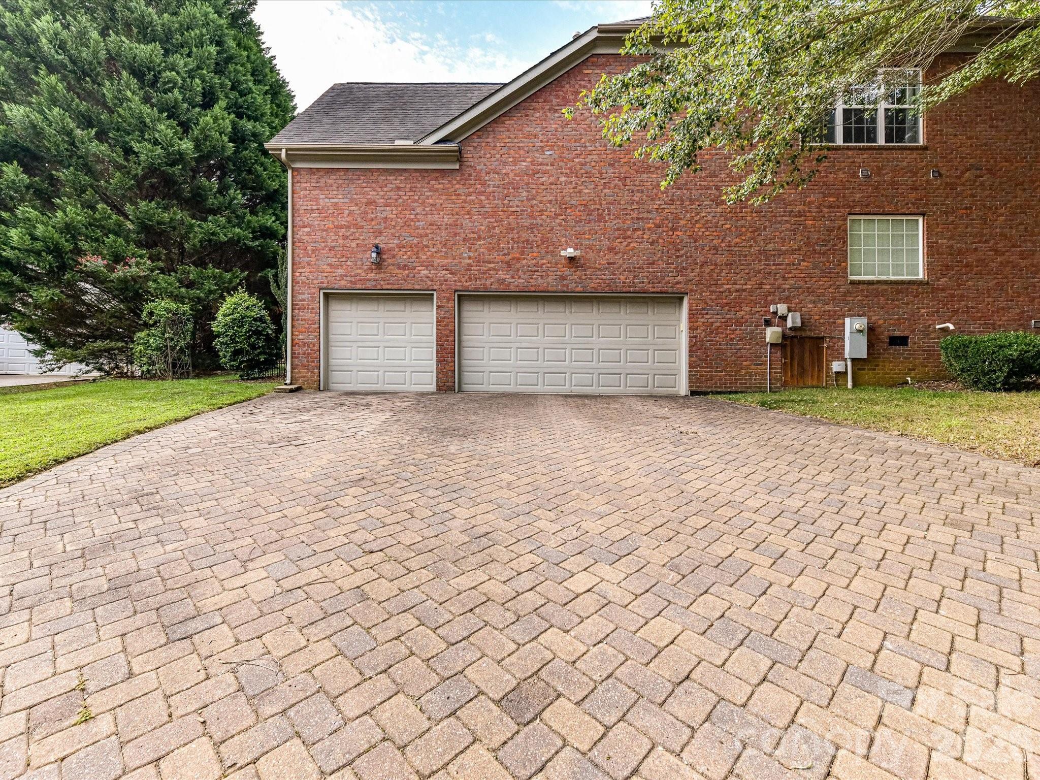 Expansive three-car garage provides abundant parking, storage, and everyday functionality. - 11203 Warfield Avenue, Huntersville