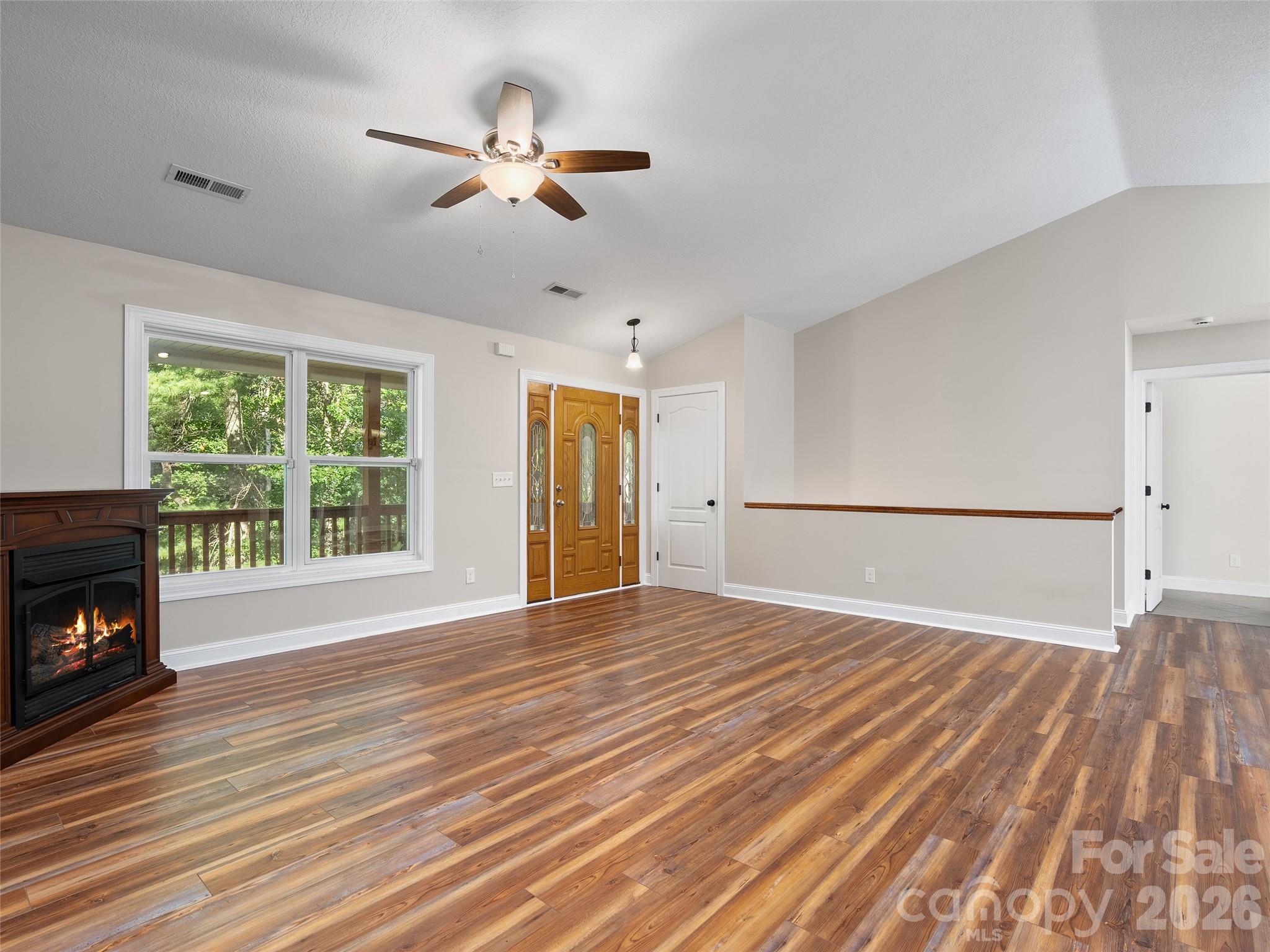 Large open Living Area with Vaulted Ceilings and Gas Fireplace - 11 Tahchee Trail, Fletcher