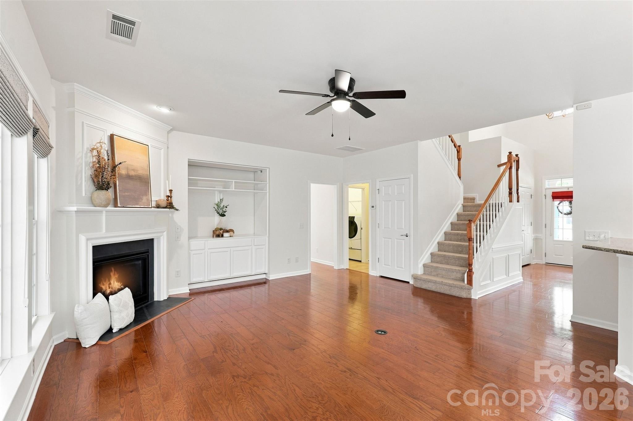 Spacious living room offers an inviting gathering space with hardwood floors and abundant natural light - 10345 Scotland Avenue, Indian Land