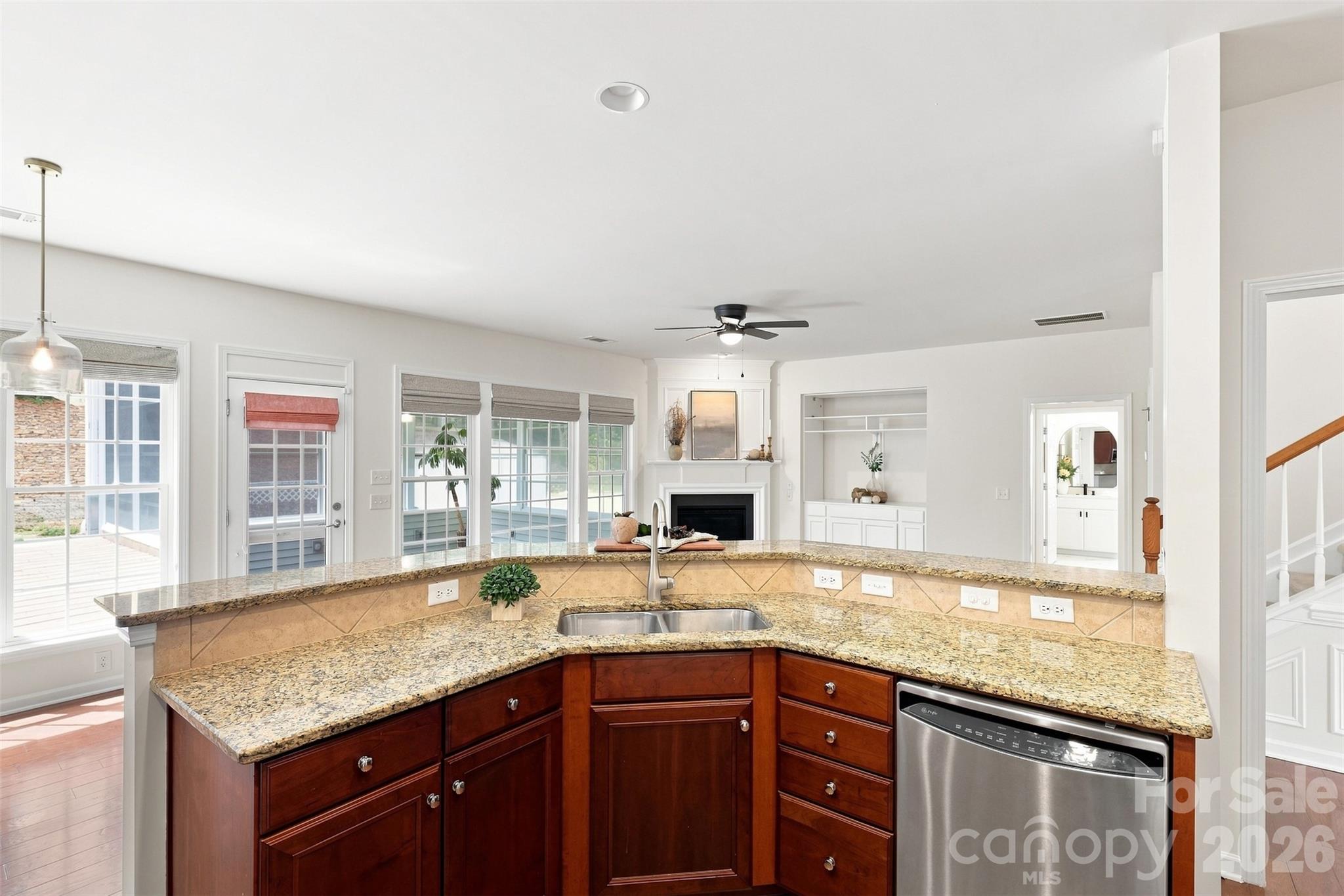 Wide sightlines from the kitchen make it easy to stay connected with guests and enjoy views into the surrounding gathering spaces while preparing meals - 10345 Scotland Avenue, Indian Land
