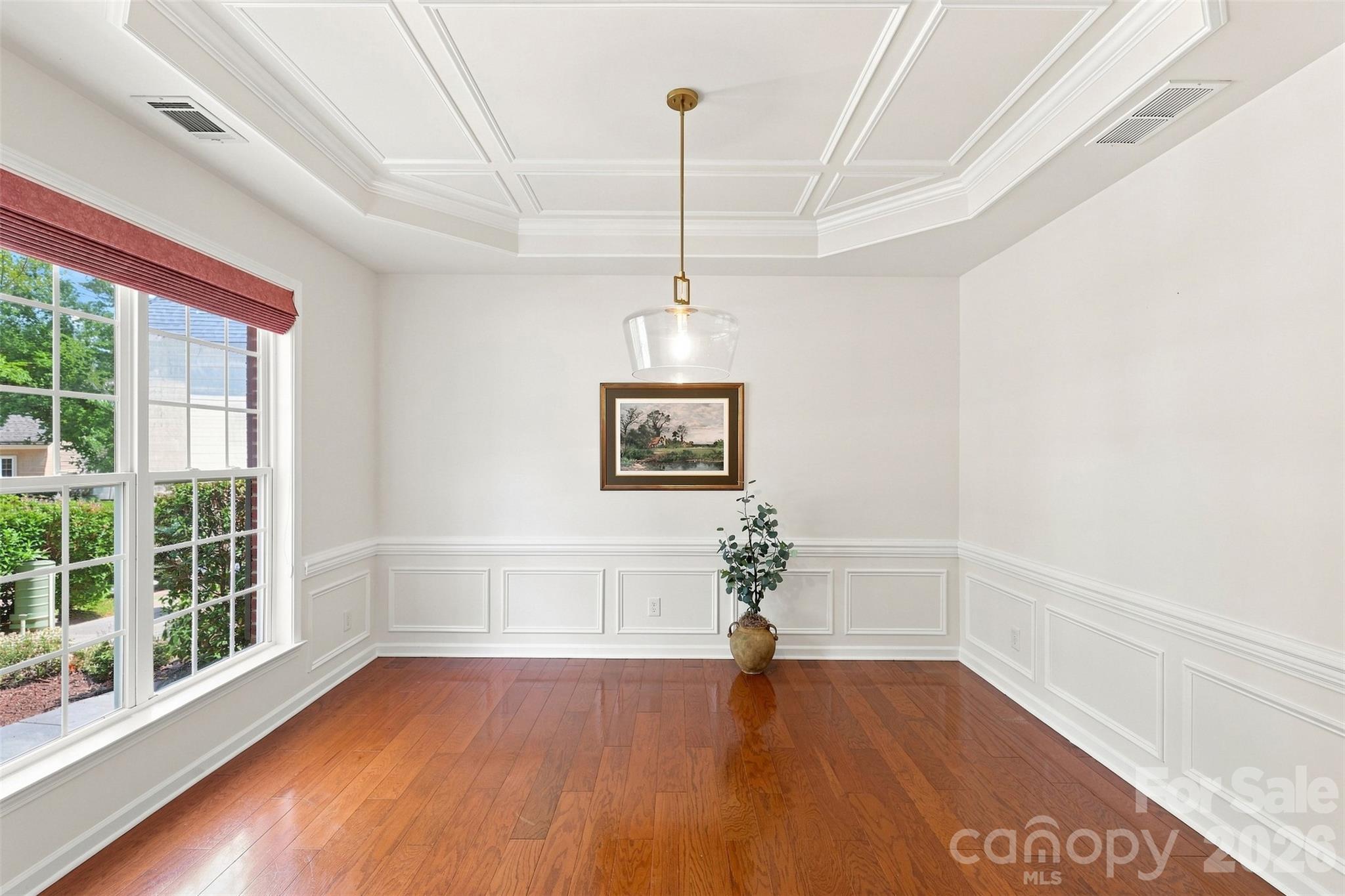 A large front-facing window fills the room with natural light while offering plenty of space for a full dining set and accompanying furniture - 10345 Scotland Avenue, Indian Land