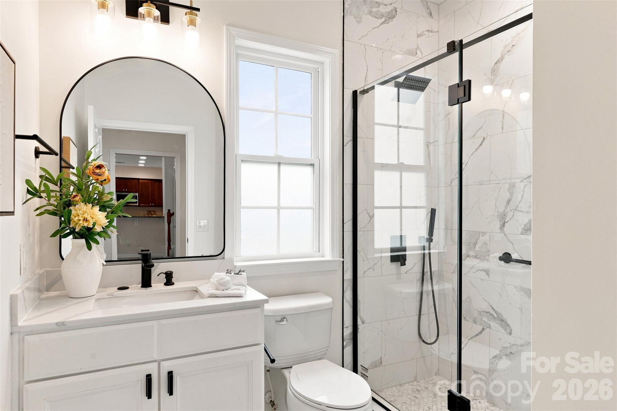 Beautifully remodeled full bath is conveniently located just outside the main-level guest bedroom, providing easy access for both overnight guests and visitors - 10345 Scotland Avenue, Indian Land