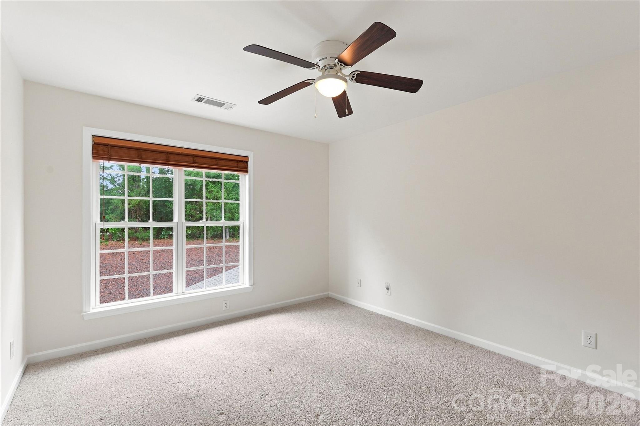 A dedicated door connects this bedroom directly to the full hall bath, creating the convenience of a semi-ensuite arrangement - 10345 Scotland Avenue, Indian Land