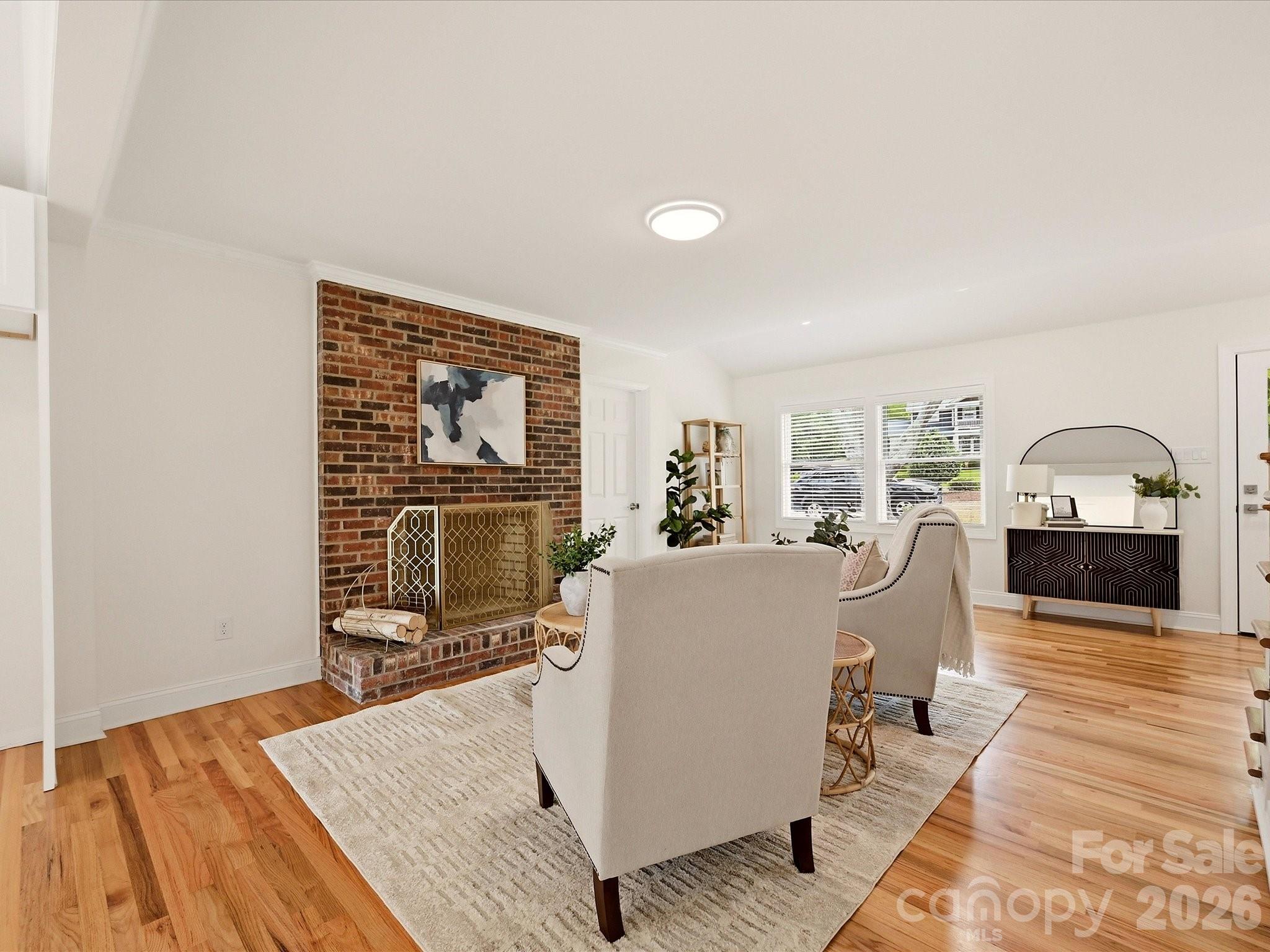 Formal living room with floor to ceiling, brick, wood burning fireplace! - 20845 Lagoona Drive, Cornelius