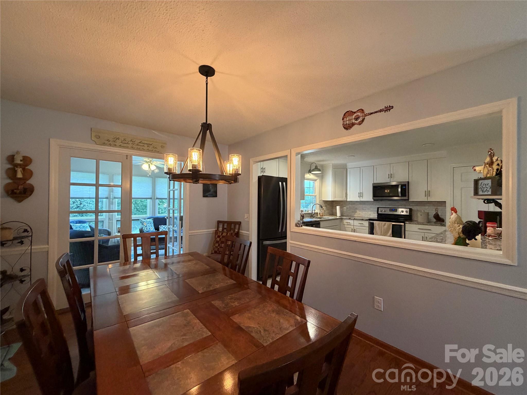 Dining Room open to Kitchen to right and Sun Room at rear - 1000 Beaumont Poplar Street, North Wilkesboro