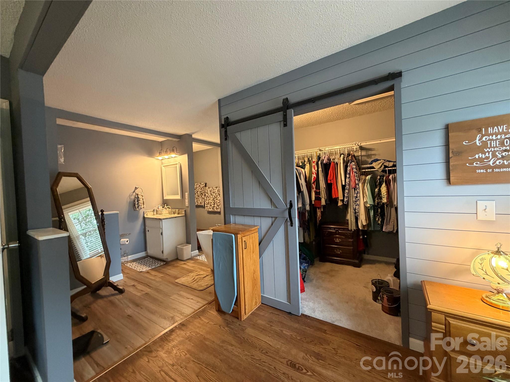 Master Bedroom with Barn Door to Master Closet open - 1000 Beaumont Poplar Street, North Wilkesboro