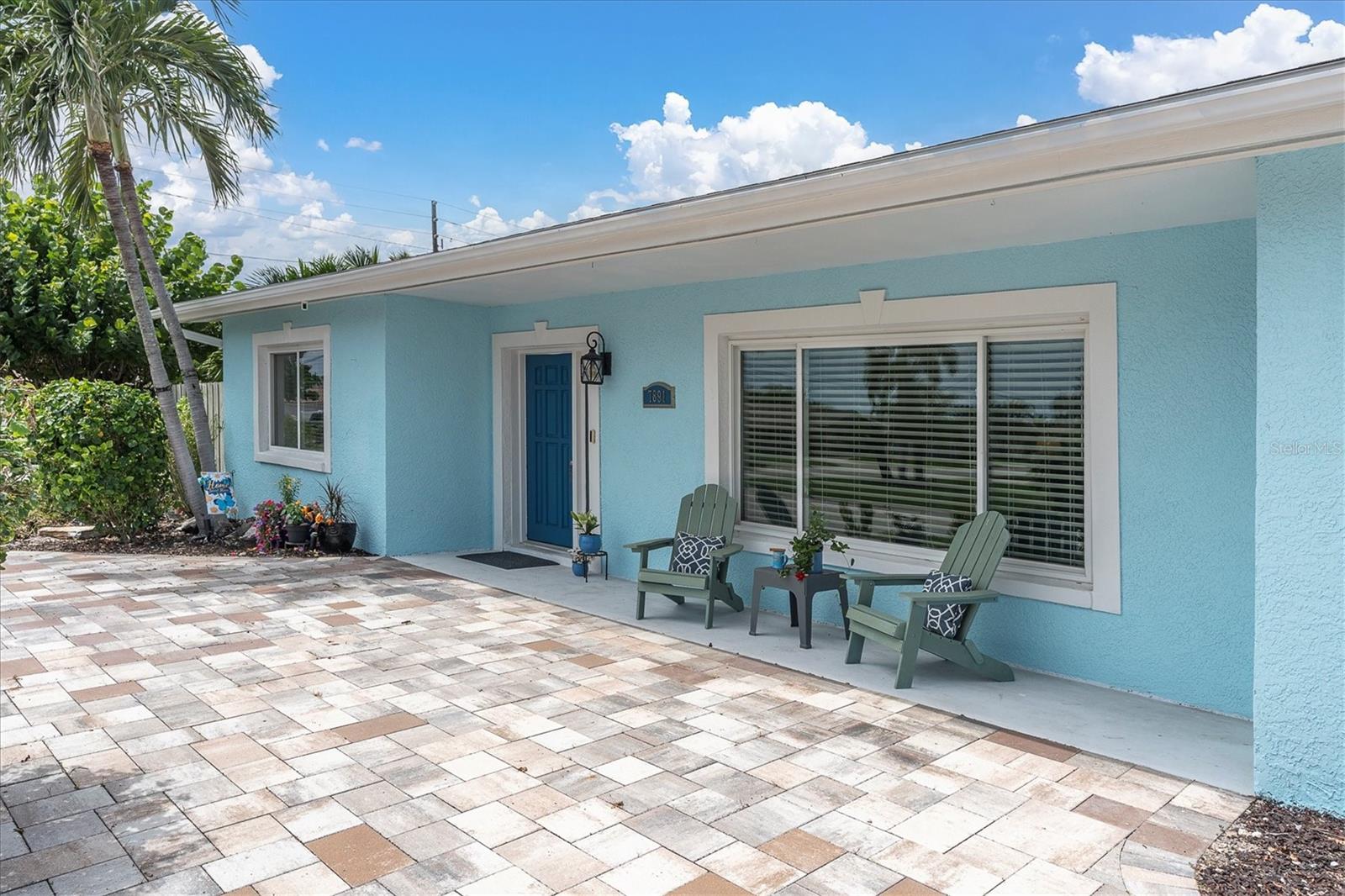 Pavered circular driveway and covered two-car carport provide plenty of convenient off-street parking. - 7891 4TH AVE S, ST PETERSBURG