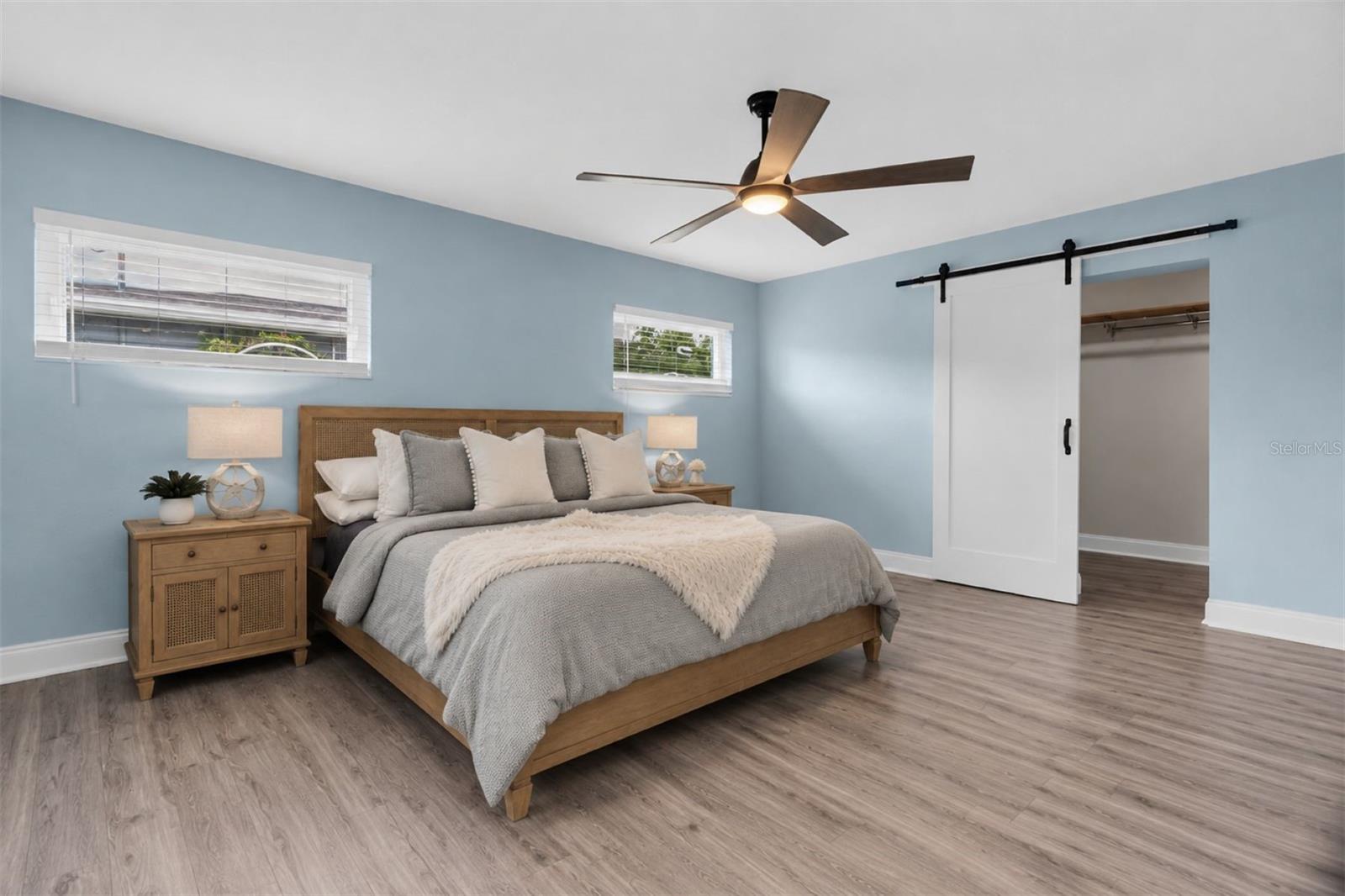 Spacious primary suite includes a large walk-in closet and a beautifully designed en-suite bath. - 7891 4TH AVE S, ST PETERSBURG