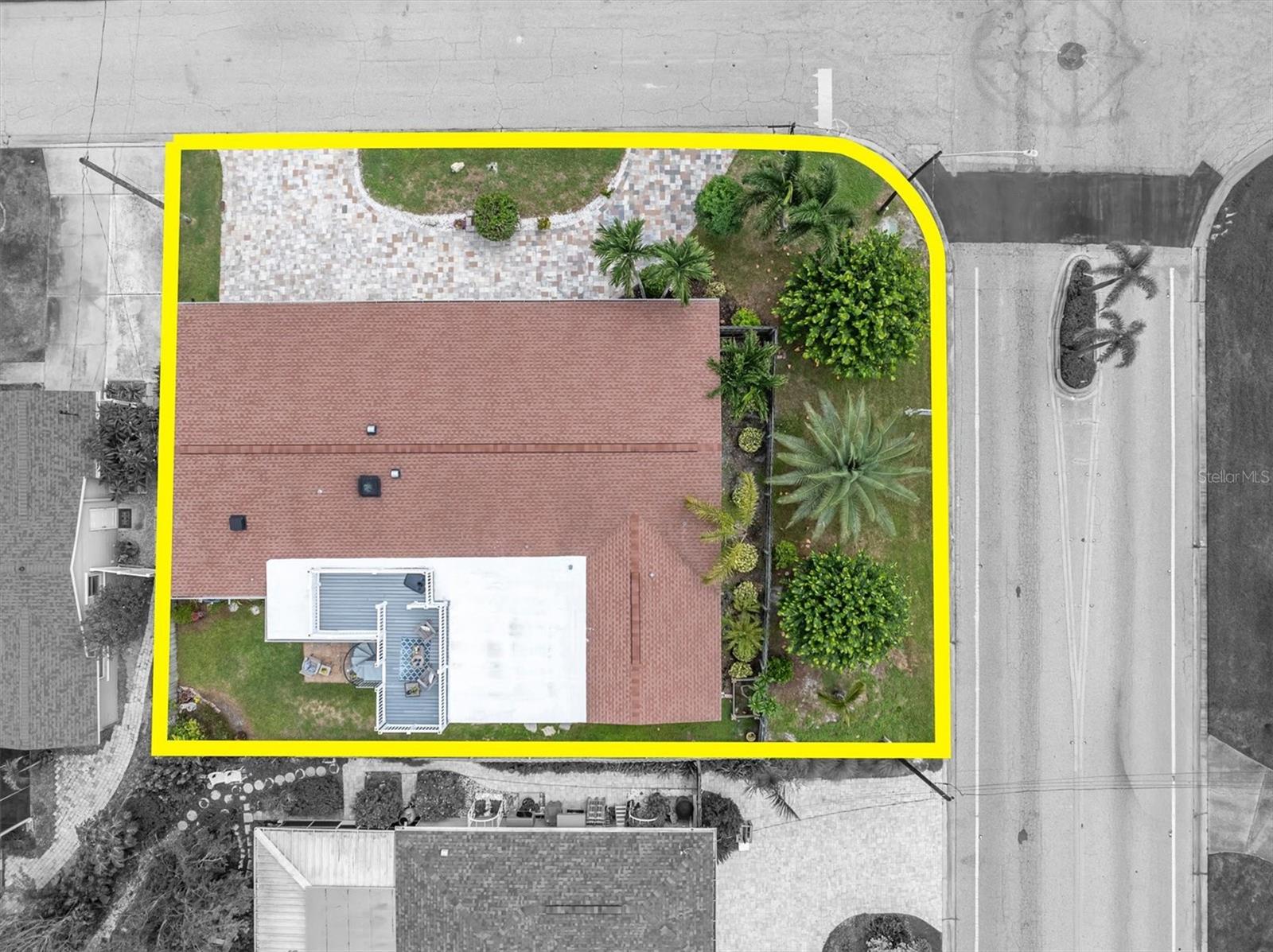 Tropical landscaping includes fruit trees, palms, colorful Birds of Paradise and exotic plants, with plenty of potential for the garden enthusiast. - 7891 4TH AVE S, ST PETERSBURG