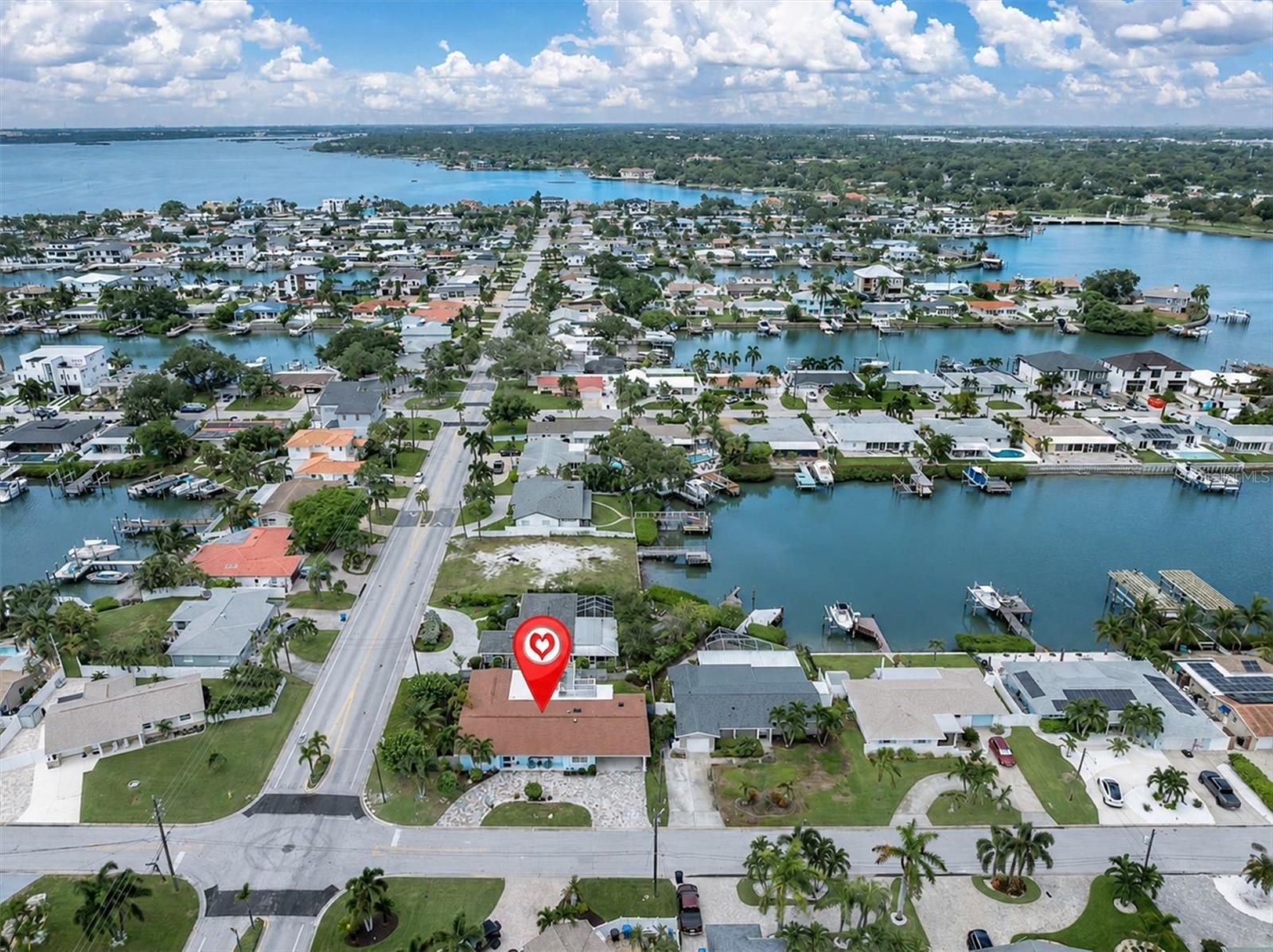 Enjoy the South Causeway Isle lifestyle with NO HOA—and hop on your bike for an approximately 10-minute ride to the white sandy beaches of Treasure Island. - 7891 4TH AVE S, ST PETERSBURG