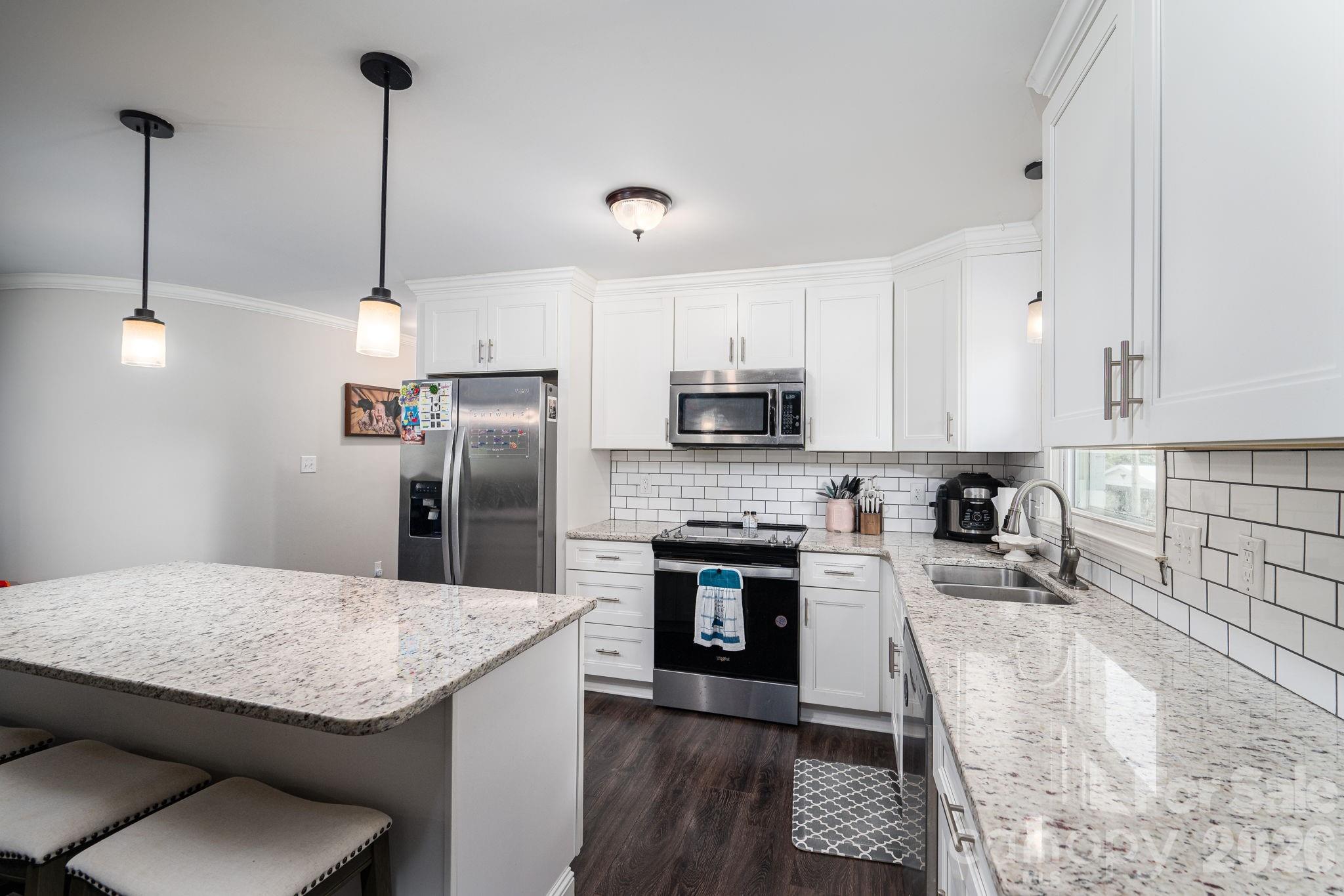Kitchen with white shaker cabinets - 1718 Woolie Road, Lincolnton