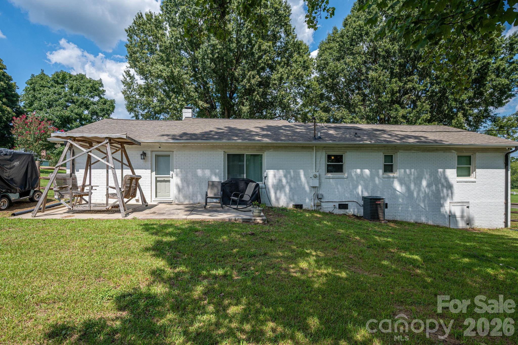 Back of the house with patio - 1718 Woolie Road, Lincolnton