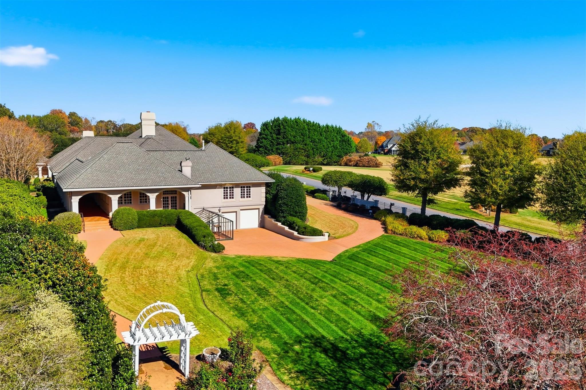 Aerial side view highlighting golf course frontage, privacy, and beautifully landscaped grounds. - 3619 Links Drive NE, Conover