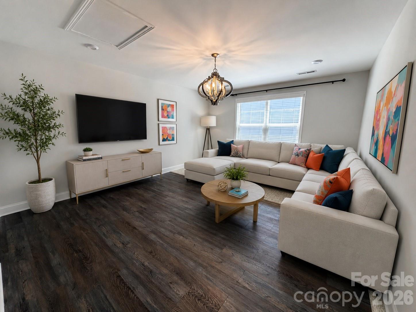 This versatile second-floor bonus/flex room offers endless possibilities. Features include abundant natural light, high-quality flooring, and ample closet space. Whether you need a playroom, game room, home gym, or dedicated craft space, this flexible area is ready to suit your lifestyle. (Digitally enhanced/staged image) - 1318 Poppy Way, Matthews