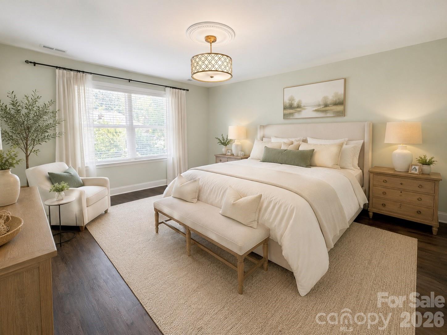 This spacious, relaxing primary suite has been freshly painted and features upgraded lighting and no carpeting. The room includes dual walk-in closets with some built-in storage. (Virtually staged image) - 1318 Poppy Way, Matthews
