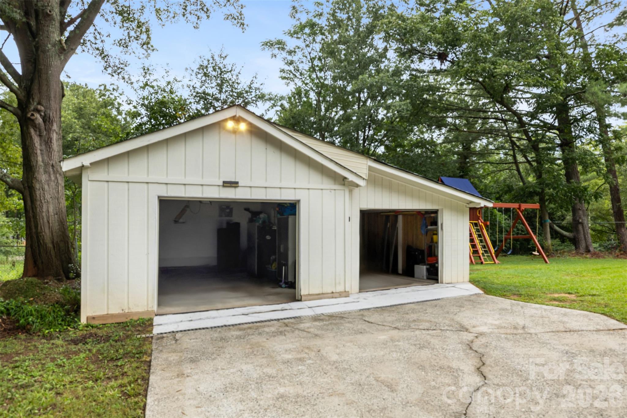 Both doors have remotes and each side fits 1 car - 821 Normandy View Street, Gastonia