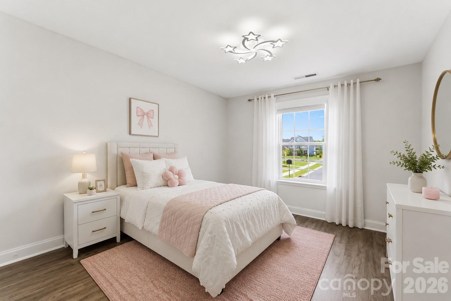 Bedroom #3 features fresh neutral paint, no carpeting, and upgraded lighting. Includes a spacious walk-in closet with custom built-ins. (virtually staged) - 1318 Poppy Way, Matthews