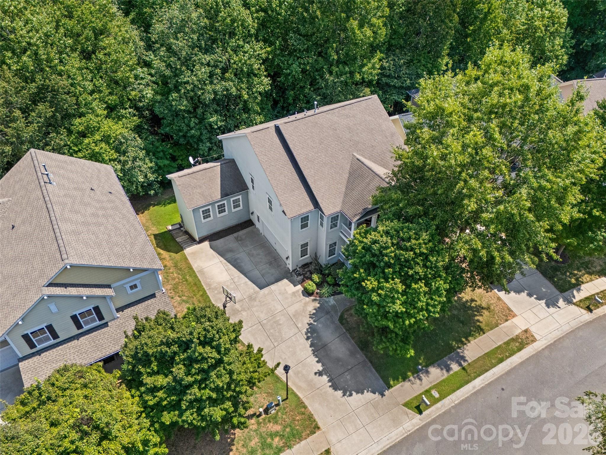 Aerial views show mature trees and large driveway - 2209 Trading Ford Drive, Waxhaw