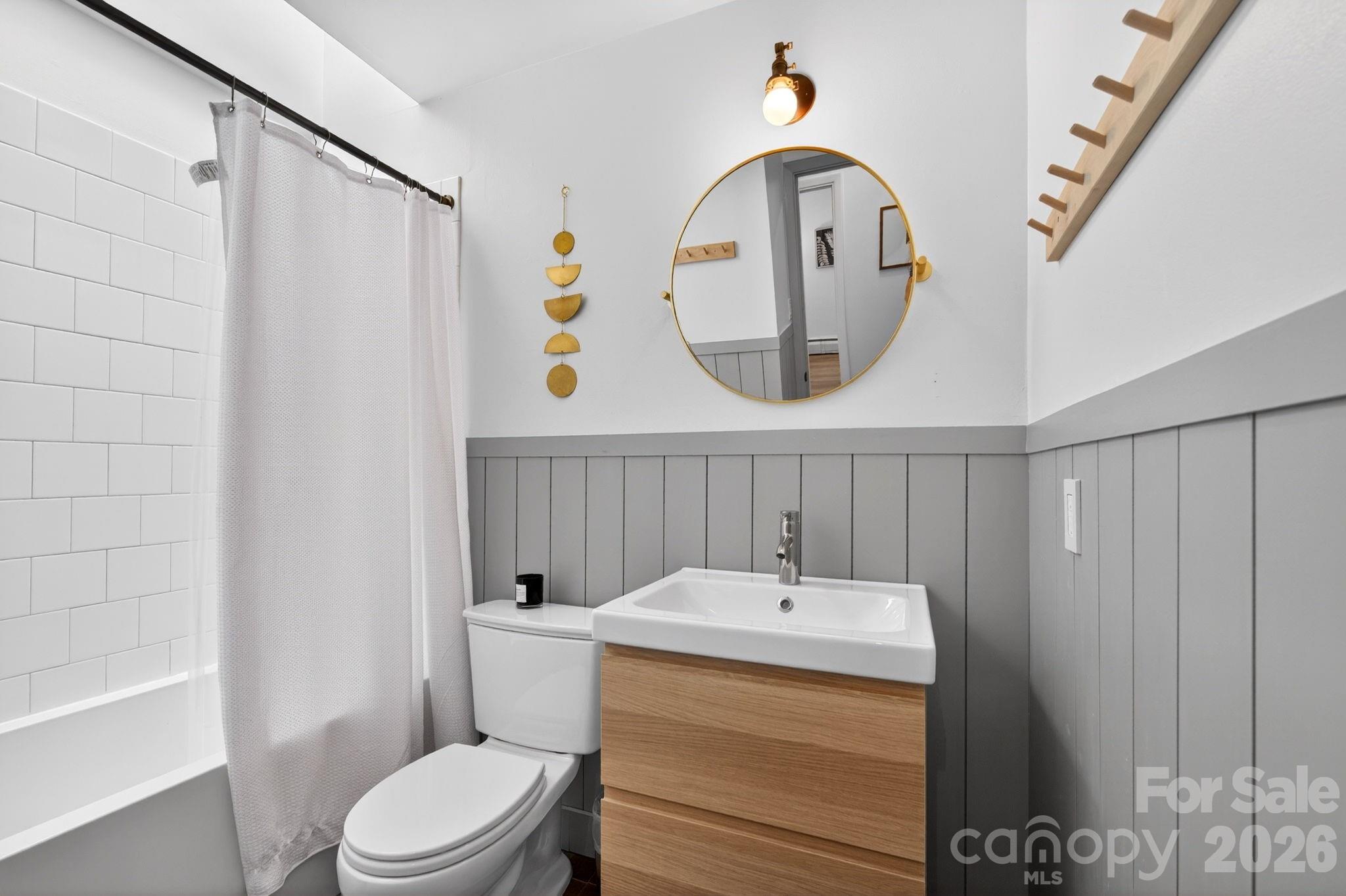 Modern wainscoting in guest bathroom - 301 Stratford Road, Asheville