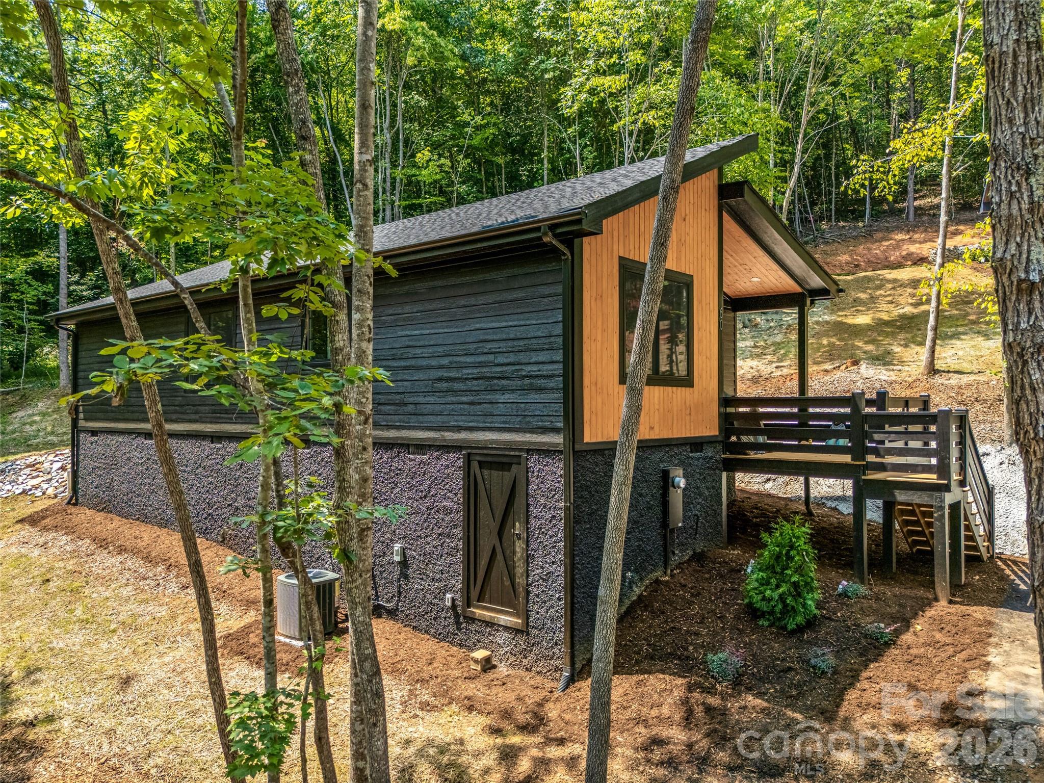 Side exterior nestled in the trees - 60 Catatoga Trail, Marion