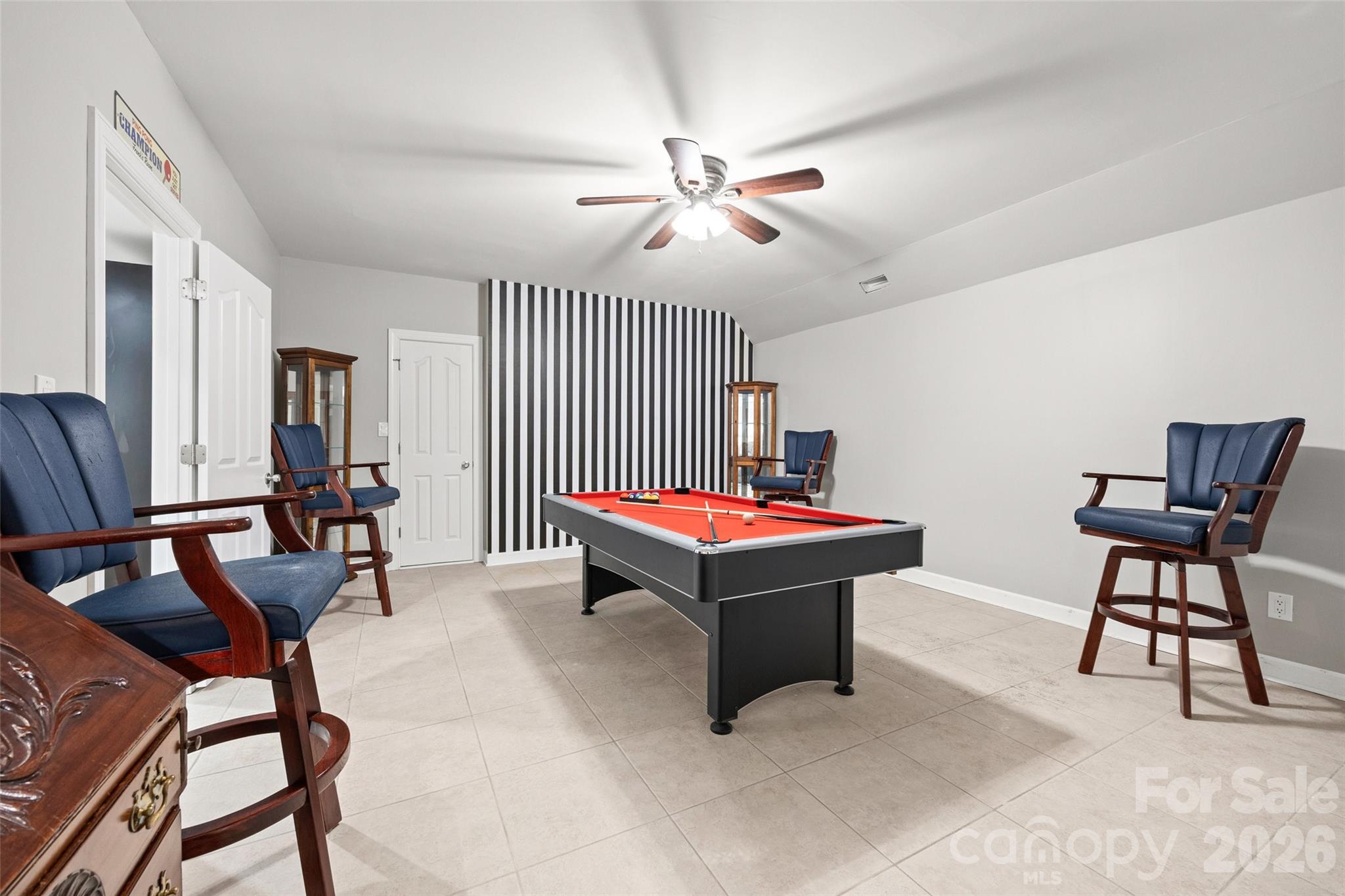 This room has had many fun nights. The pool table has a ping pong table that fits right on top. 4 billiard chairs to complete the look - 771 Cherry Hills Place, Rock Hill